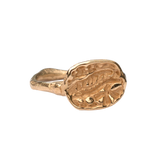 Close-up of Hand-Carved FRIKA Ring Featuring Fossil Fern and Floral Design
