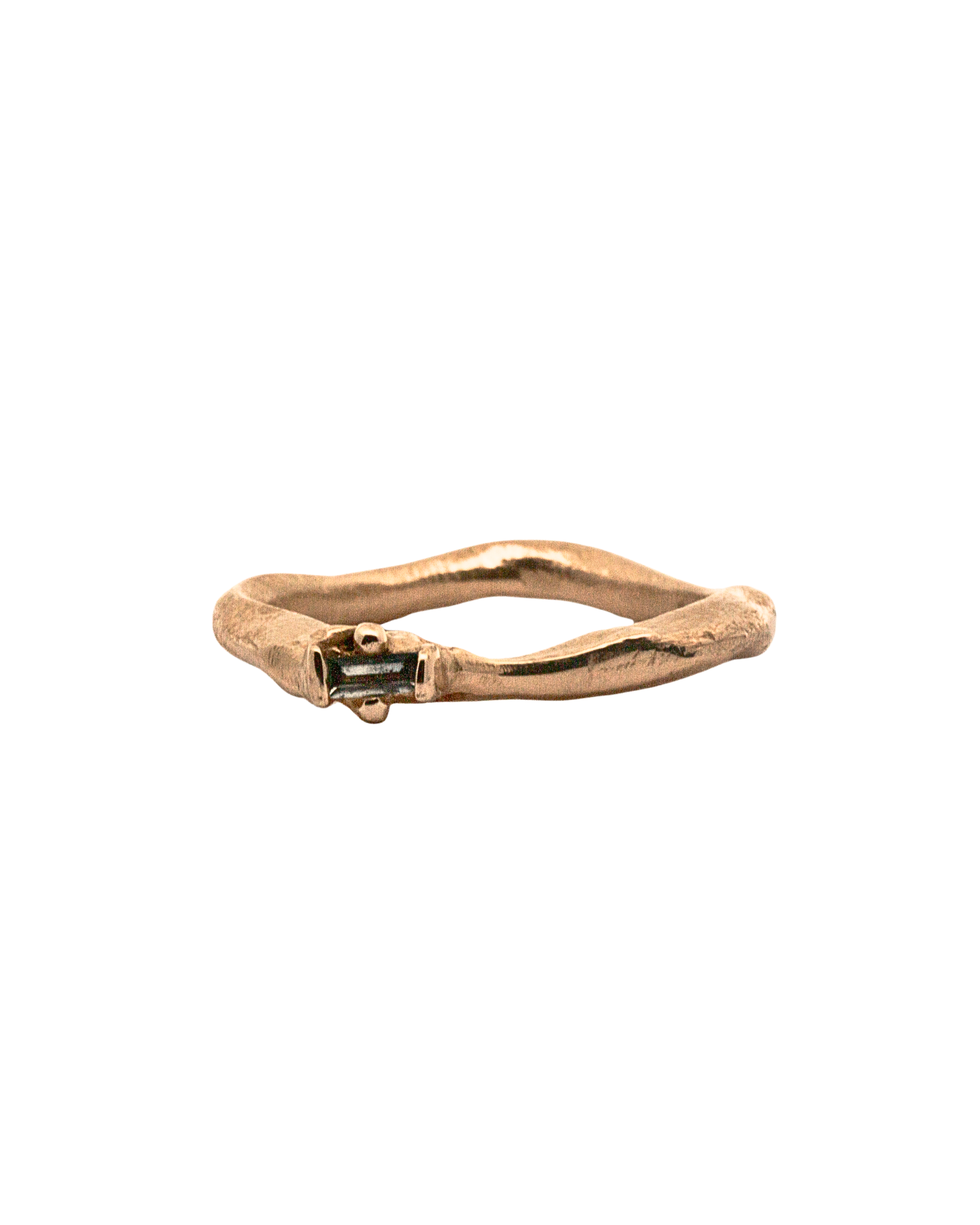 Close-up of Hand-Carved LOTTE Ring Featuring Offset Ruby Baguette