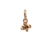 Close-up of IDUN charm showcasing hand-carved floral details