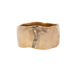 Close-up of SIGR WATER ring showcasing wavy edges and hammered texture