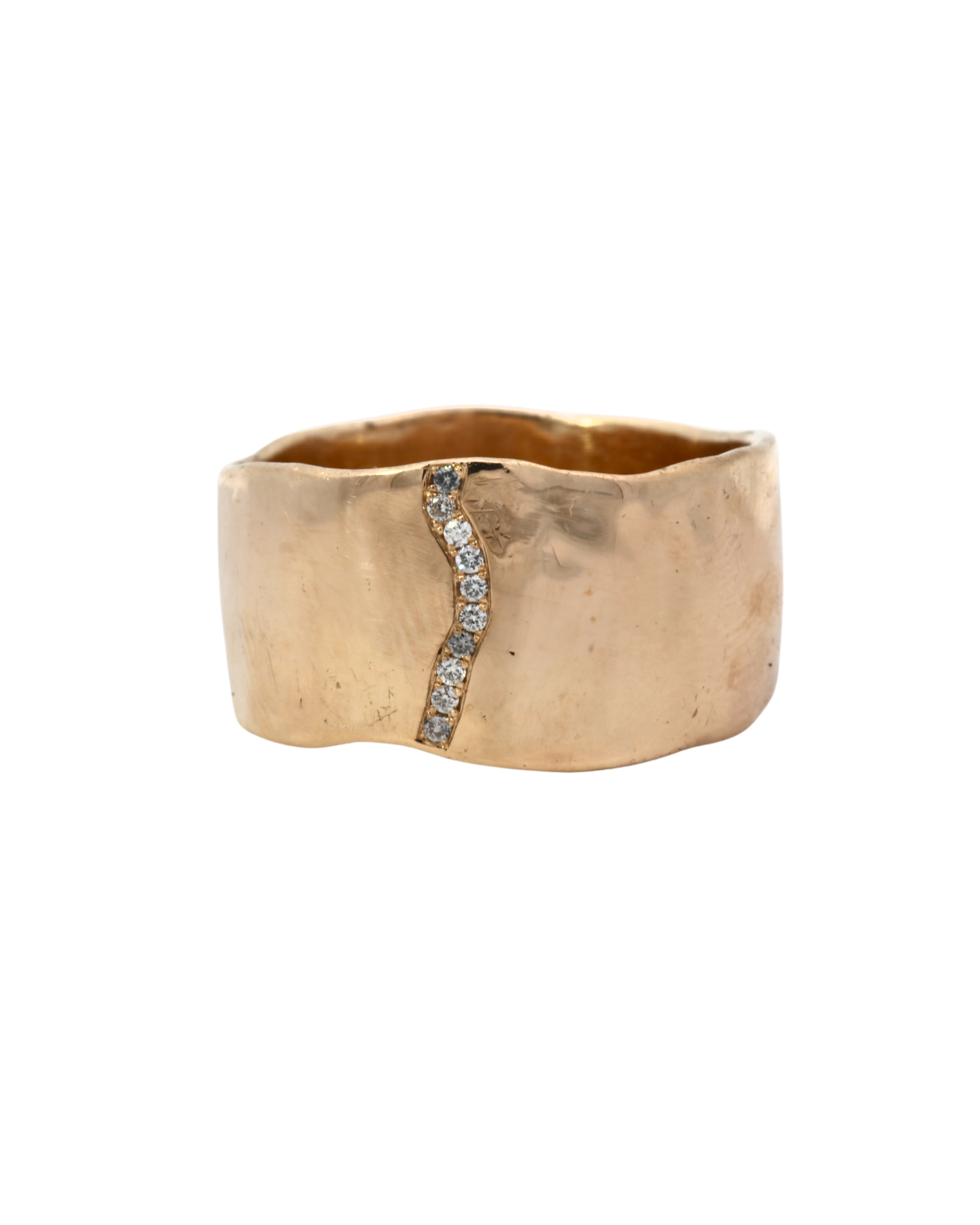 Close-up of SIGR WATER ring showcasing wavy edges and hammered texture