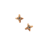 Gold star stud earrings with diamond center on black background