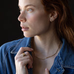 Model Wearing TILDA MINI Huggie Hoops with Personalized Letter Charms