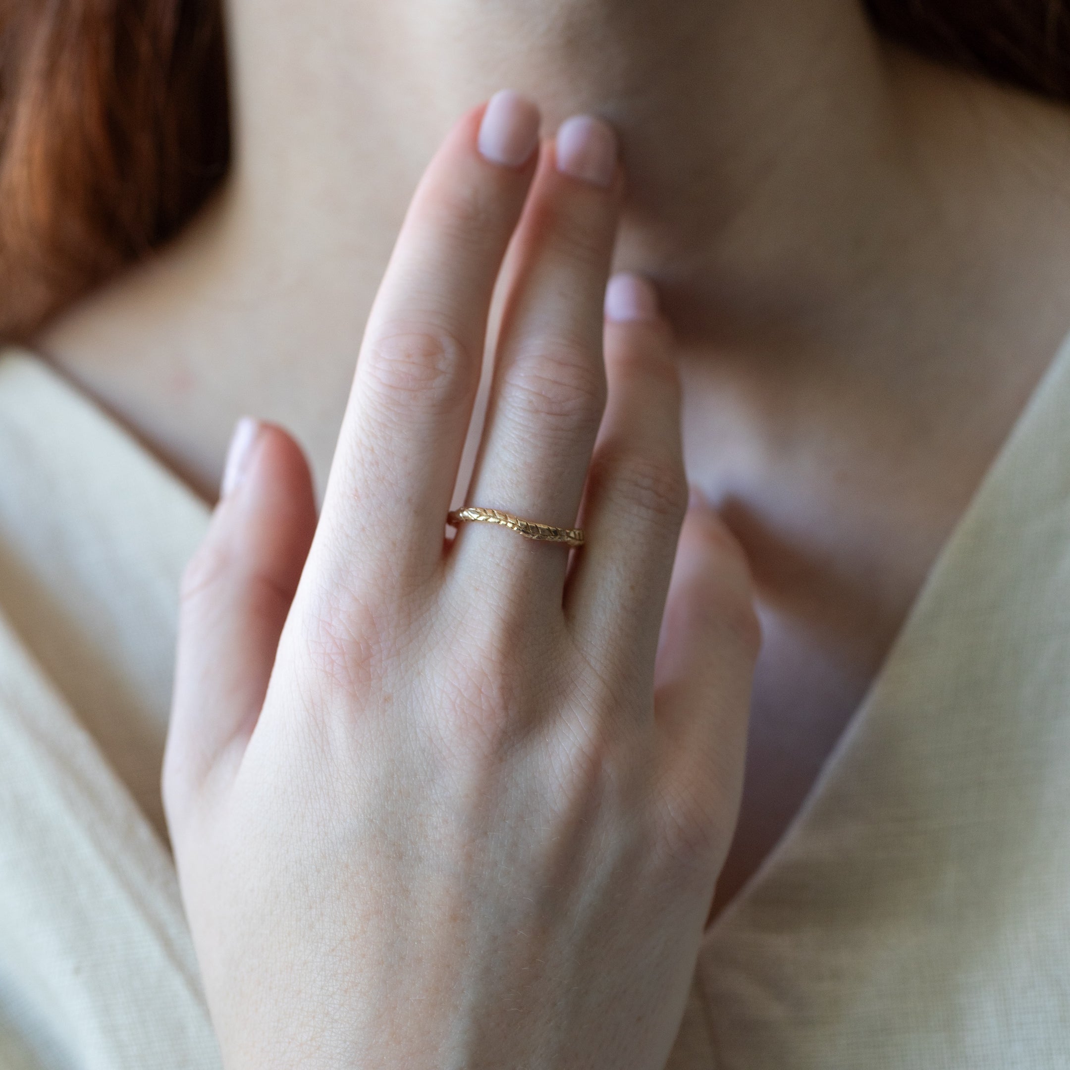 hand-carved fern ring cast in 14k gold with hammered texture