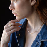 Side View of JONSI Necklace Highlighting Hand-Shaped Links