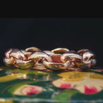 Close-up of Hand-Carved ROI Chain Link Ring Showcasing Textured Finish