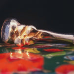 Close-up of Hand-Carved Flower Ring with Rustic Salt and Pepper Diamond