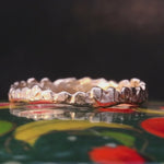 Close-up of Hand-Carved SIGGE Ring with Crown-Inspired Design