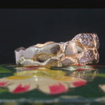 ERNA ring in recycled platinum with peek-a-boo cutouts and pavé diamonds