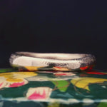 Close-up of Hand-Carved MADRONE Heavy Ring Showcasing Undulating Form