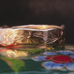 Close-up of Hand-Carved WESTERN FLORAL Ring Showcasing Hammered Facets