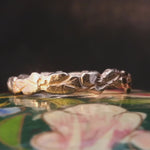 Close-up of Hand-Carved SINDRE Ring Showcasing Floral Design