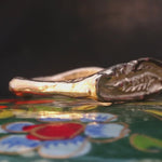 Close-up of Hand-Carved FRIKA Ring Showcasing Textured Wavy Band