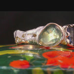 Close-up of No. 84 ring showcasing hand-carved texture and gemstone details