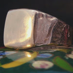 Close-up of Hand-Carved HANSI Ring Showcasing Distorted Edges