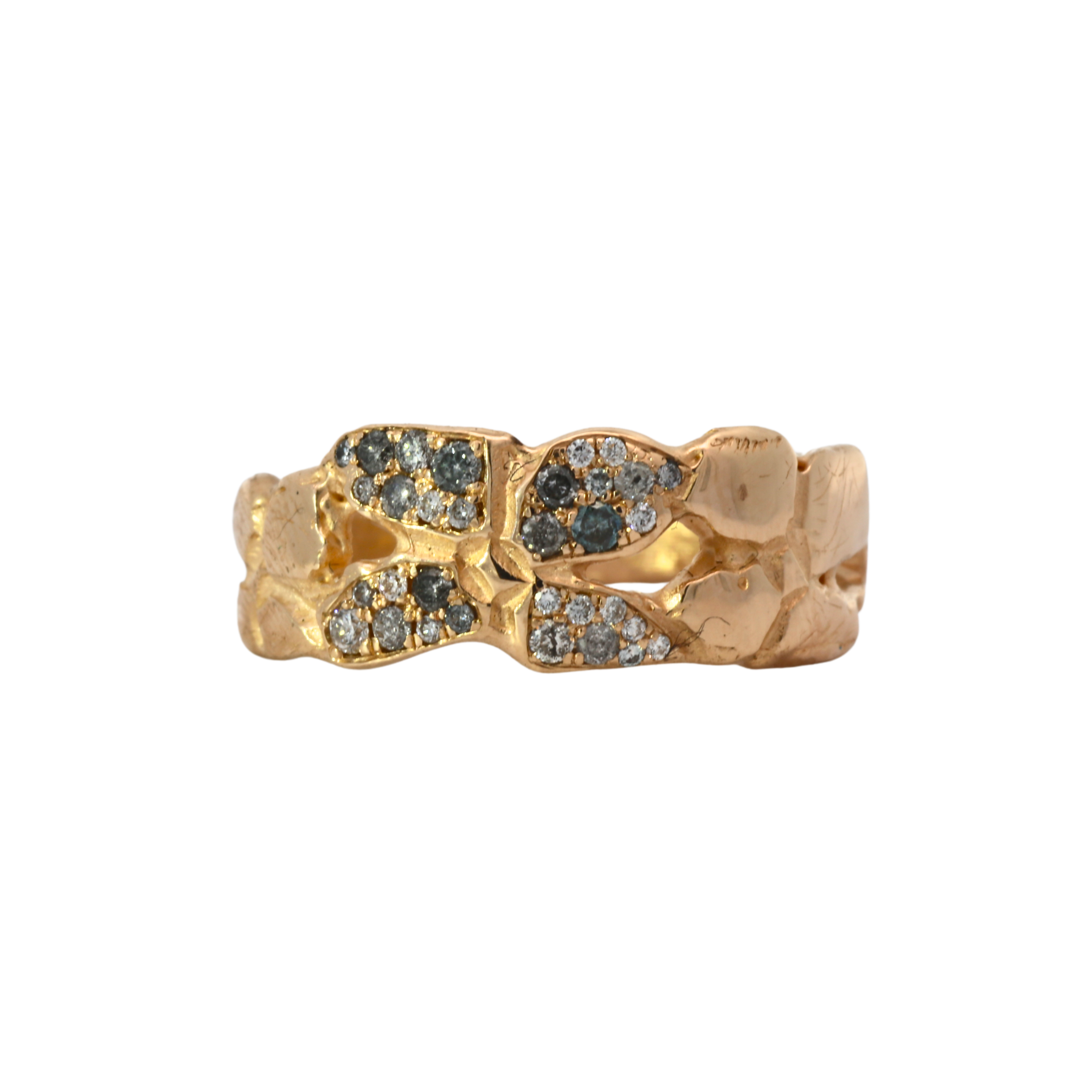 Close-up of ERNA ring showcasing four-petal floral design and hammered texture