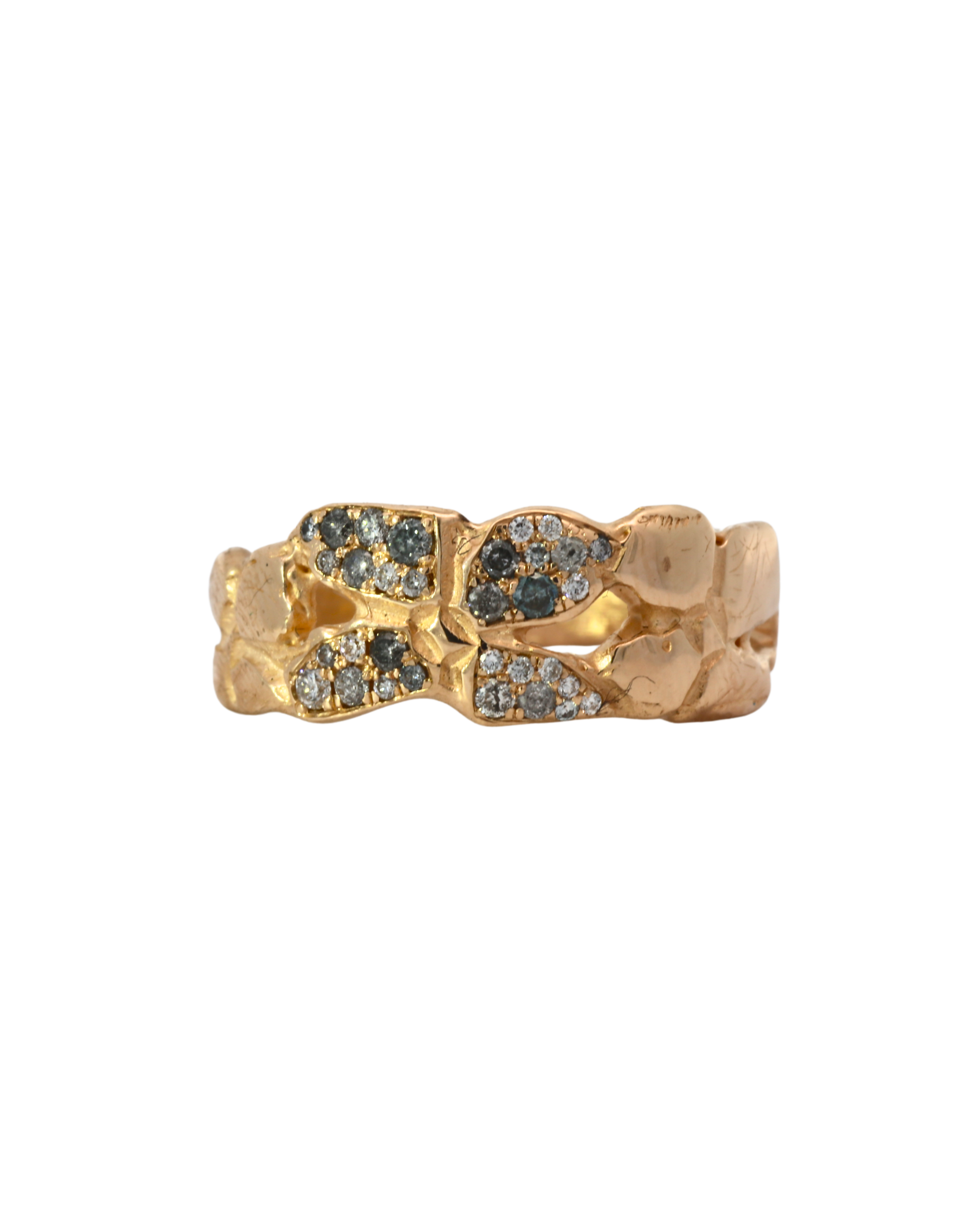 Close-up of ERNA ring showcasing four-petal floral design and hammered texture