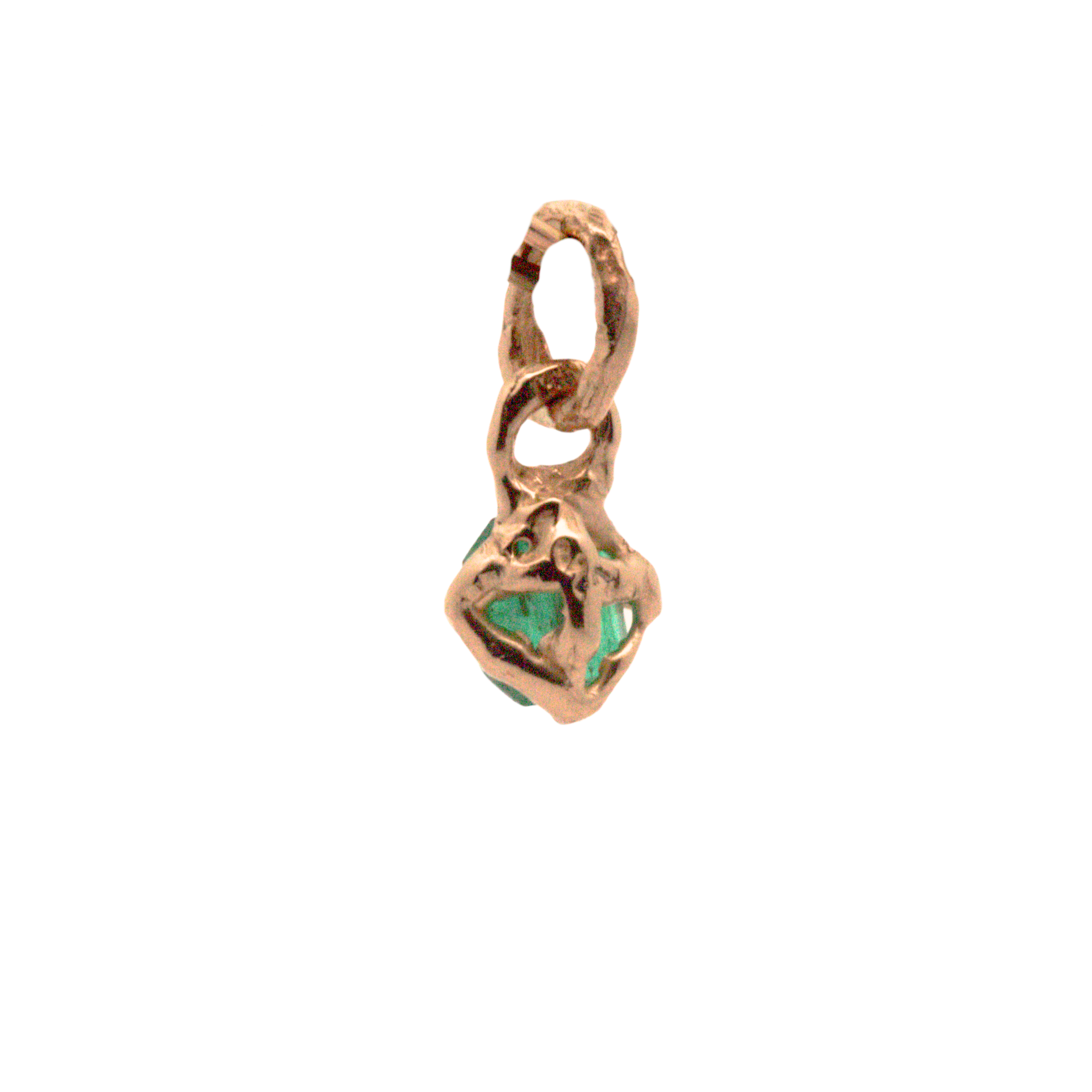Close-up of Hand-Carved Emerald Charm with Sculptural Design