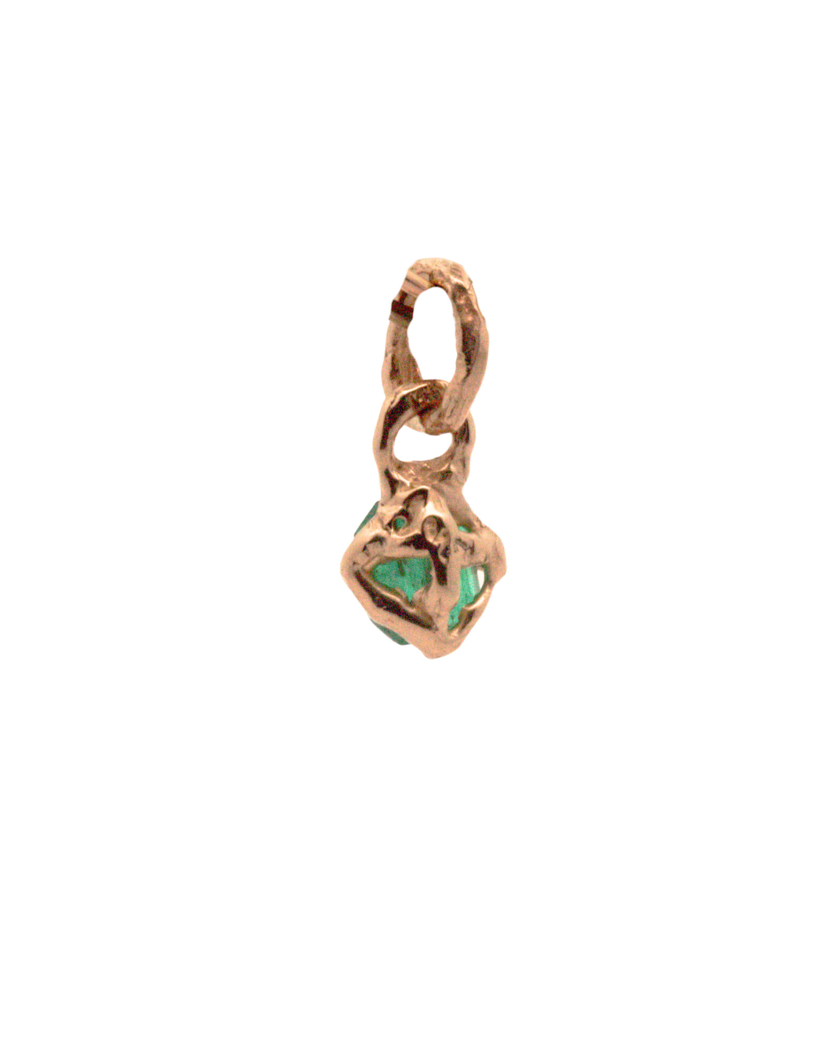 Close-up of Hand-Carved Emerald Charm with Sculptural Design