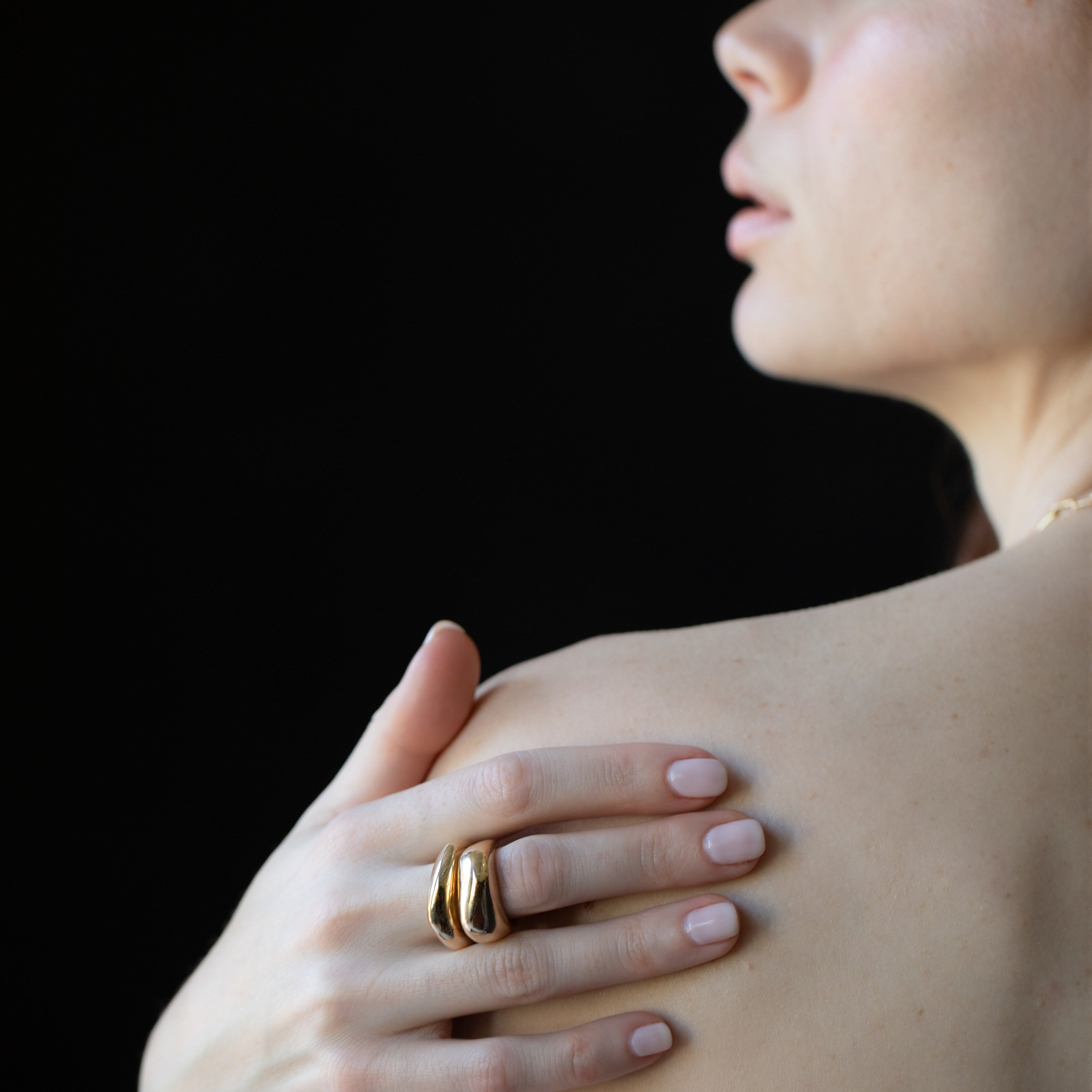 Close-up of Hand-Carved GLENR Dome Rings with Sculptural Design