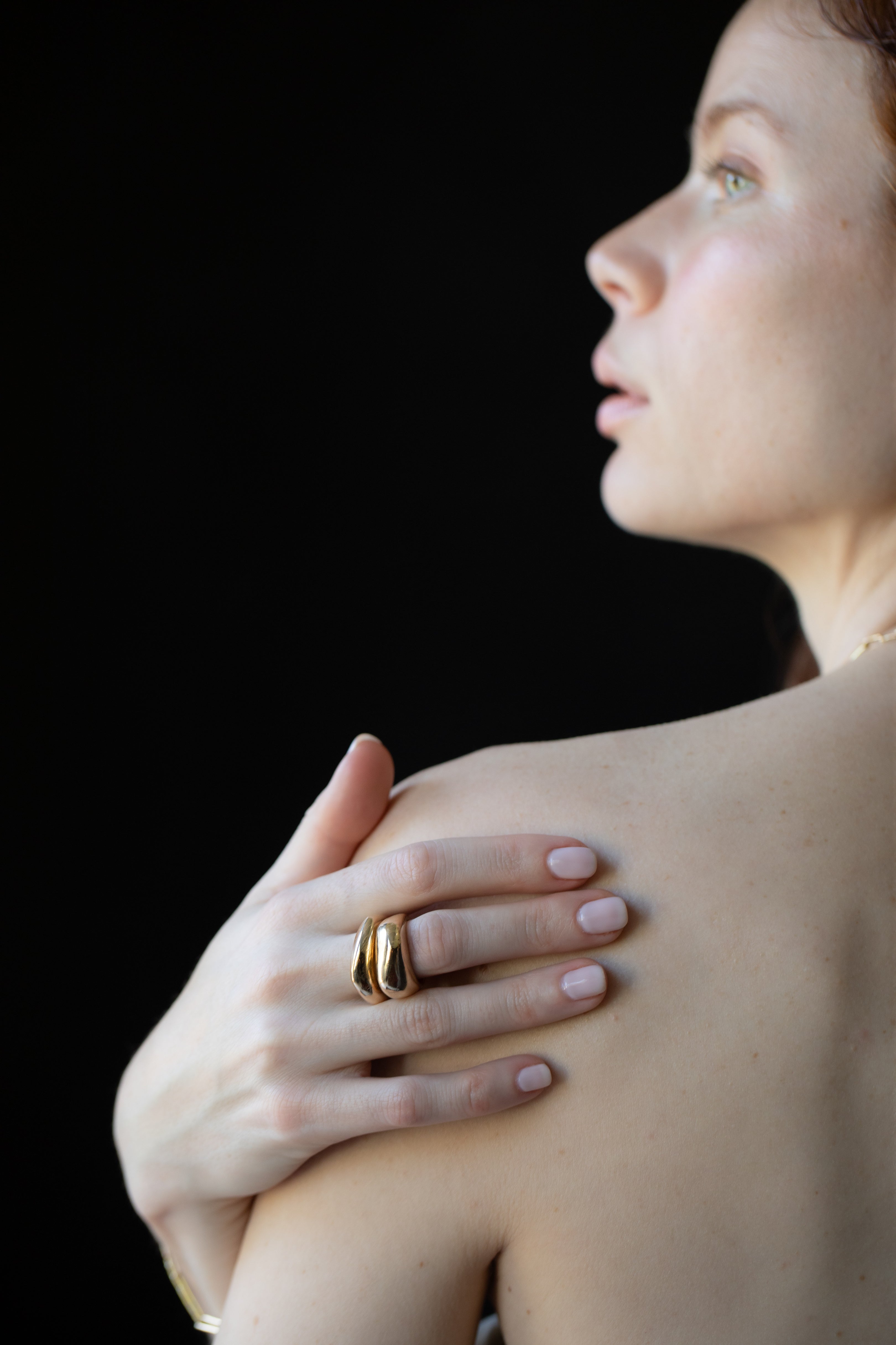 Close-up of Hand-Carved GLENR Dome Rings with Sculptural Design