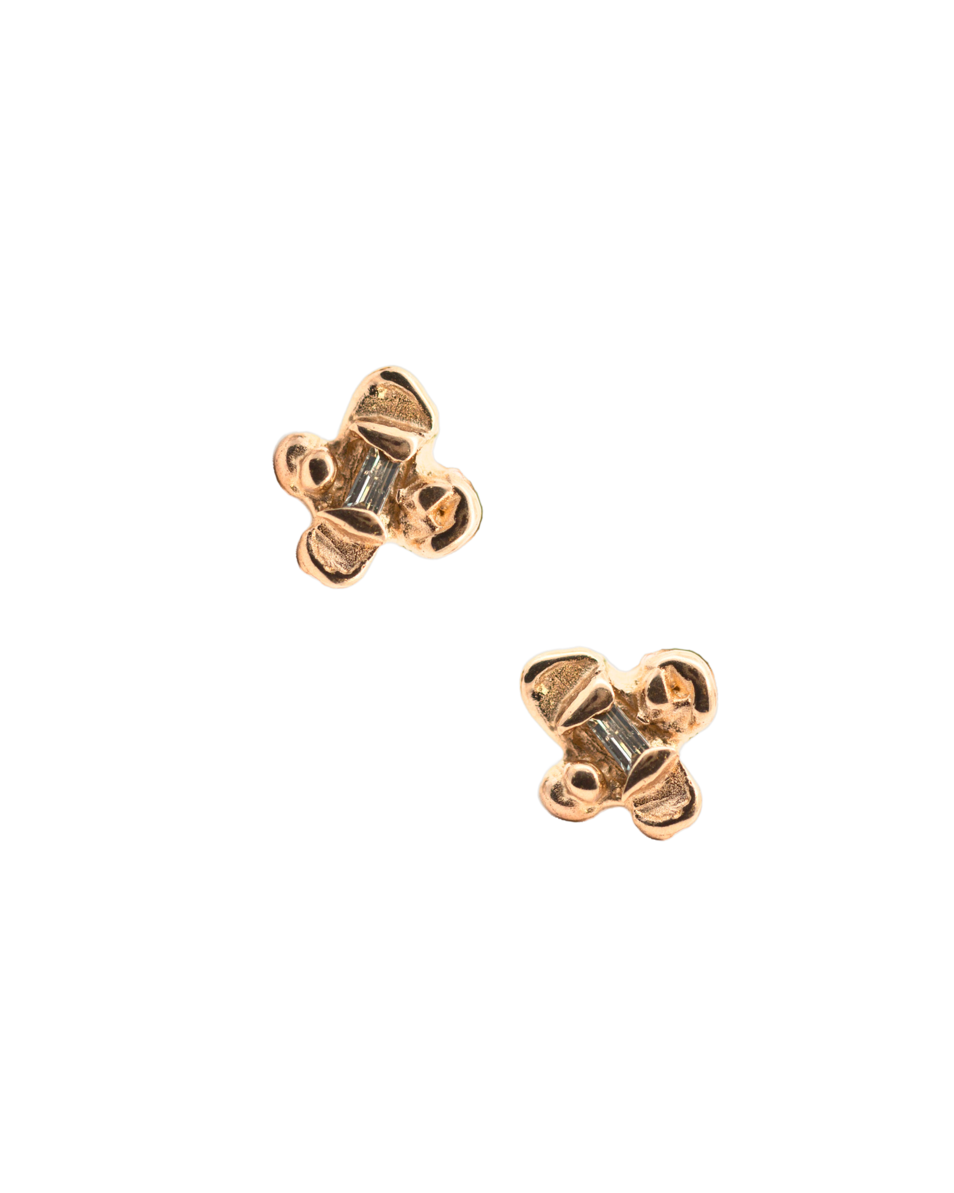 Close-up of Hand-Carved IDUN Earrings Featuring Four-Petal Flower Design