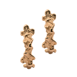 Close-up of Hand-Carved IDUN Floral Hoop Huggie Earrings with Sculptural Design