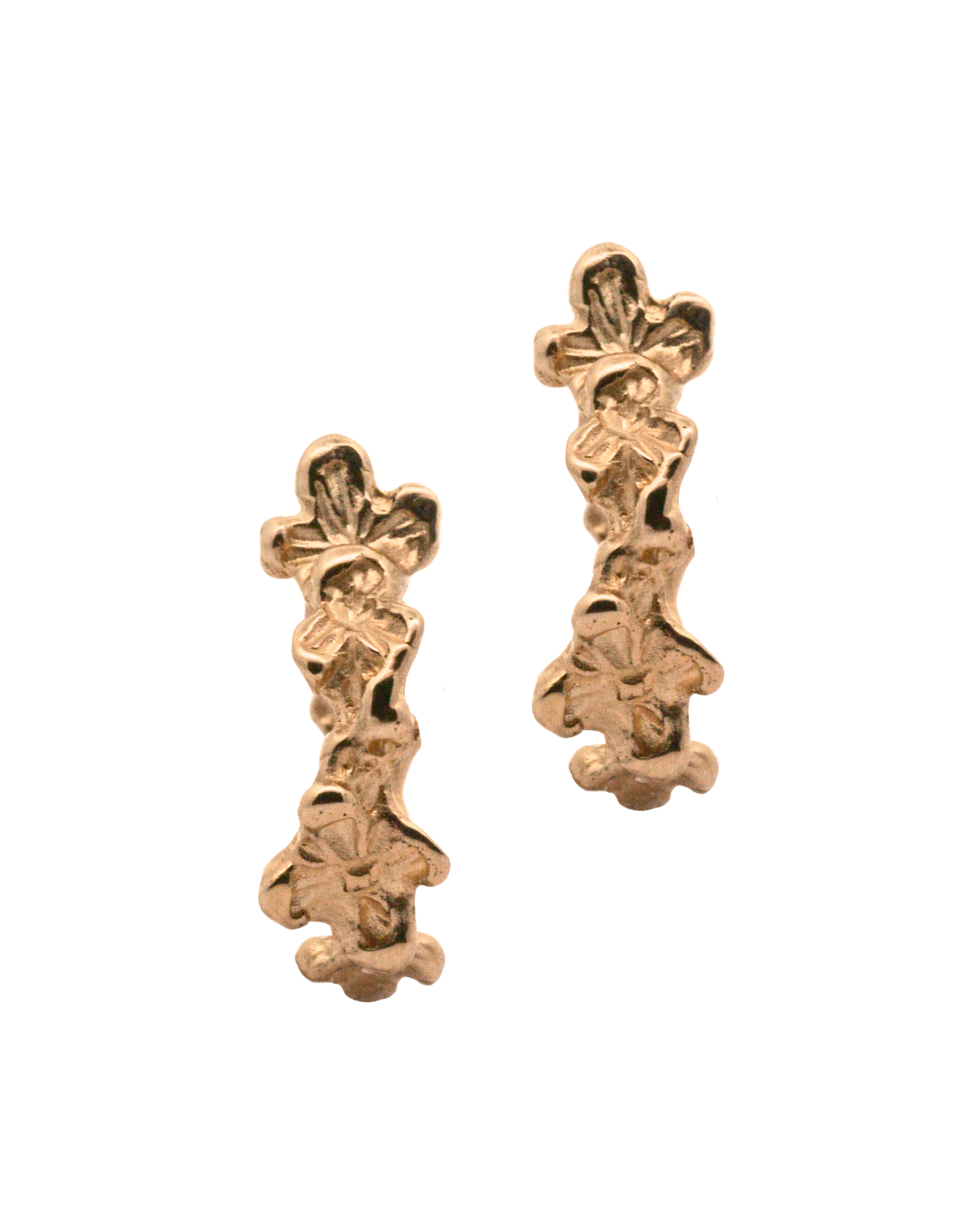 Close-up of Hand-Carved IDUN Floral Hoop Huggie Earrings with Sculptural Design