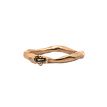 Close-up of Hand-Carved LOTTE Ring Featuring Offset Ruby Baguette

