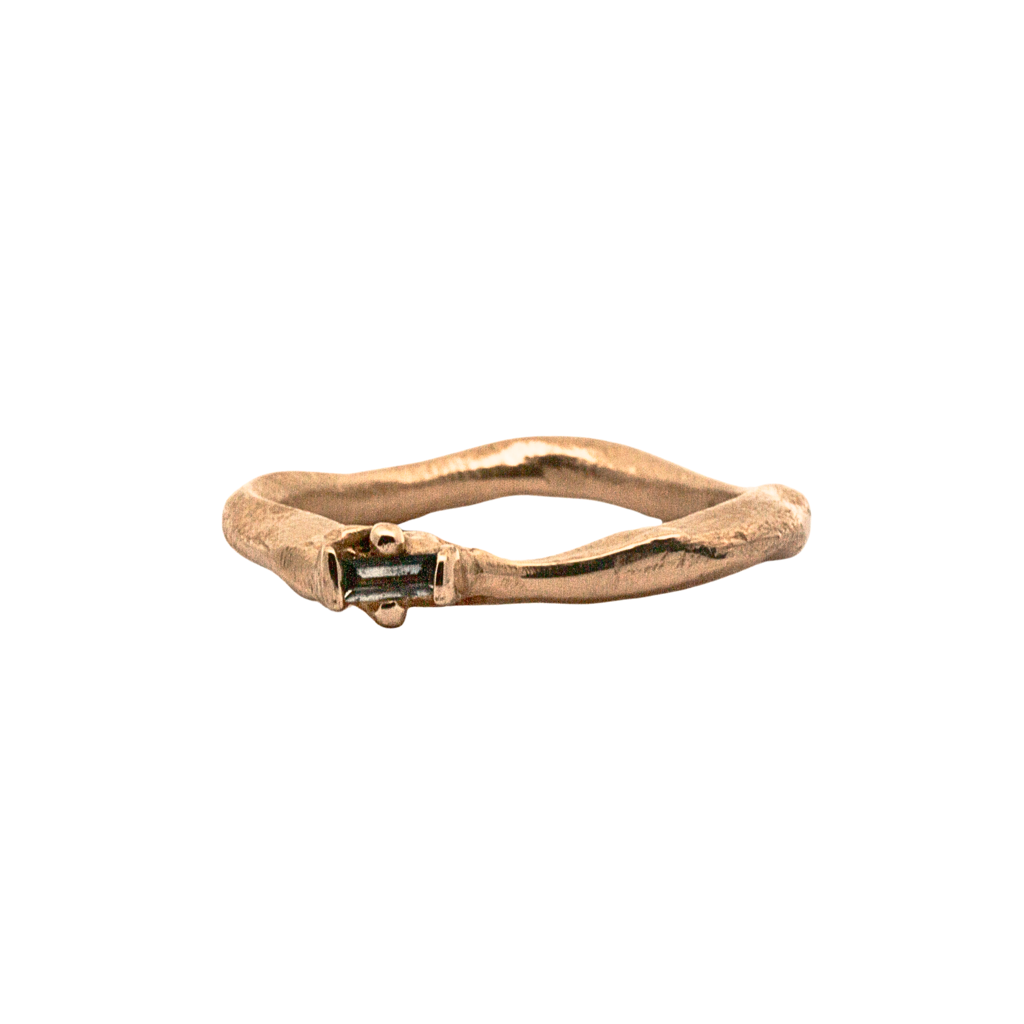 Close-up of Hand-Carved LOTTE Ring Featuring Offset Ruby Baguette

