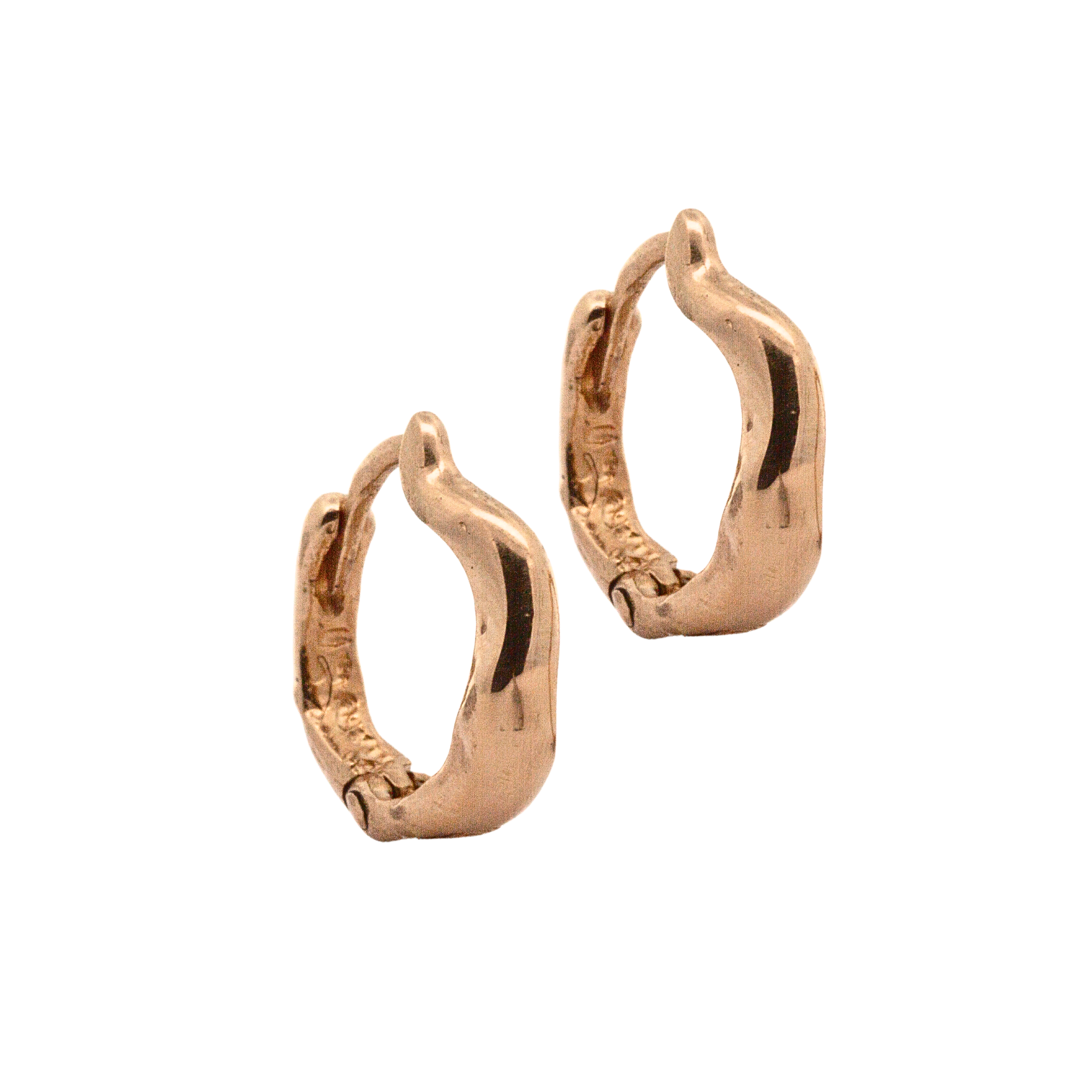 Close-up of Hand-Carved TILDA Huggie Hoops with Sculptural Design