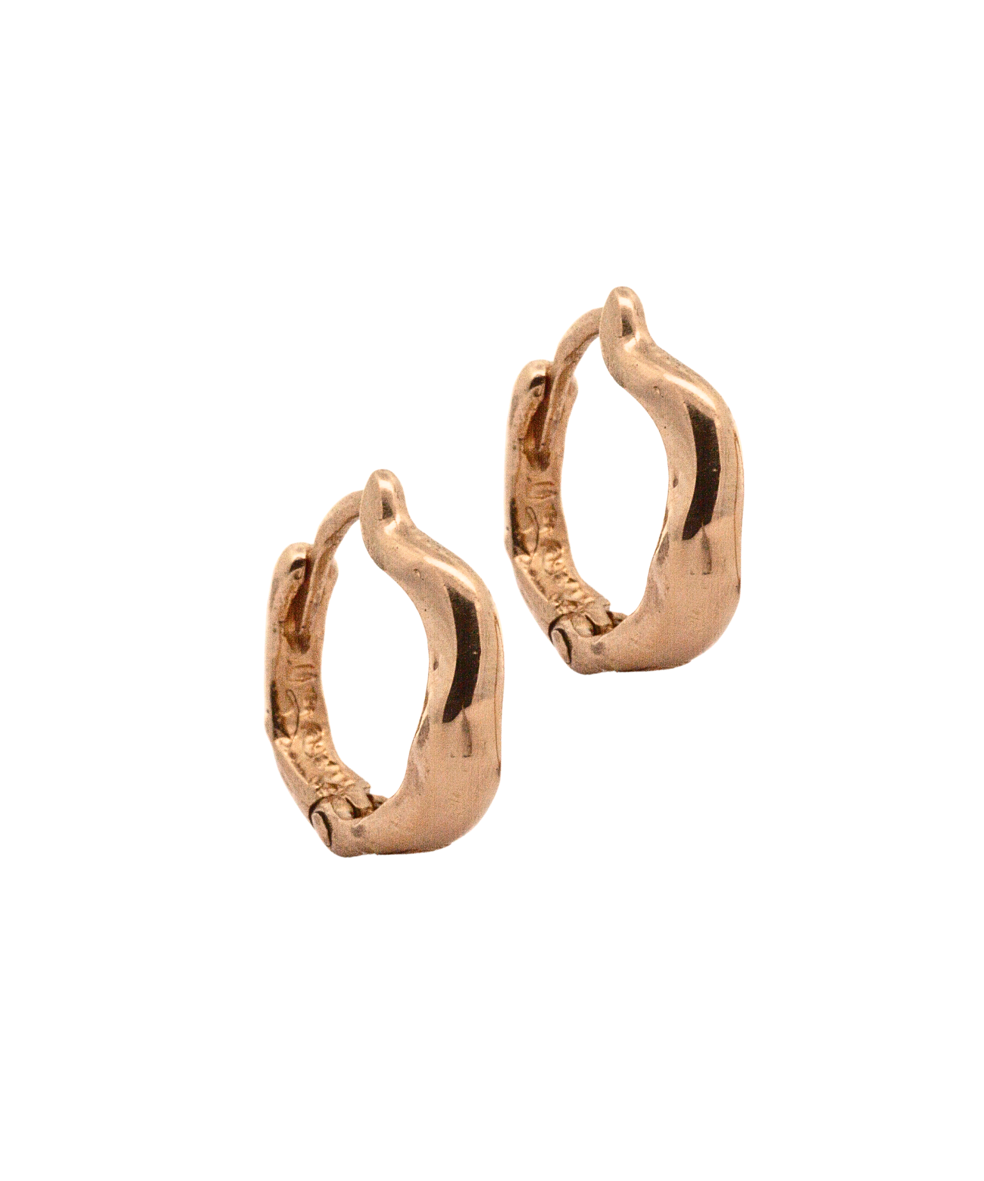 Close-up of Hand-Carved TILDA Huggie Hoops with Sculptural Design