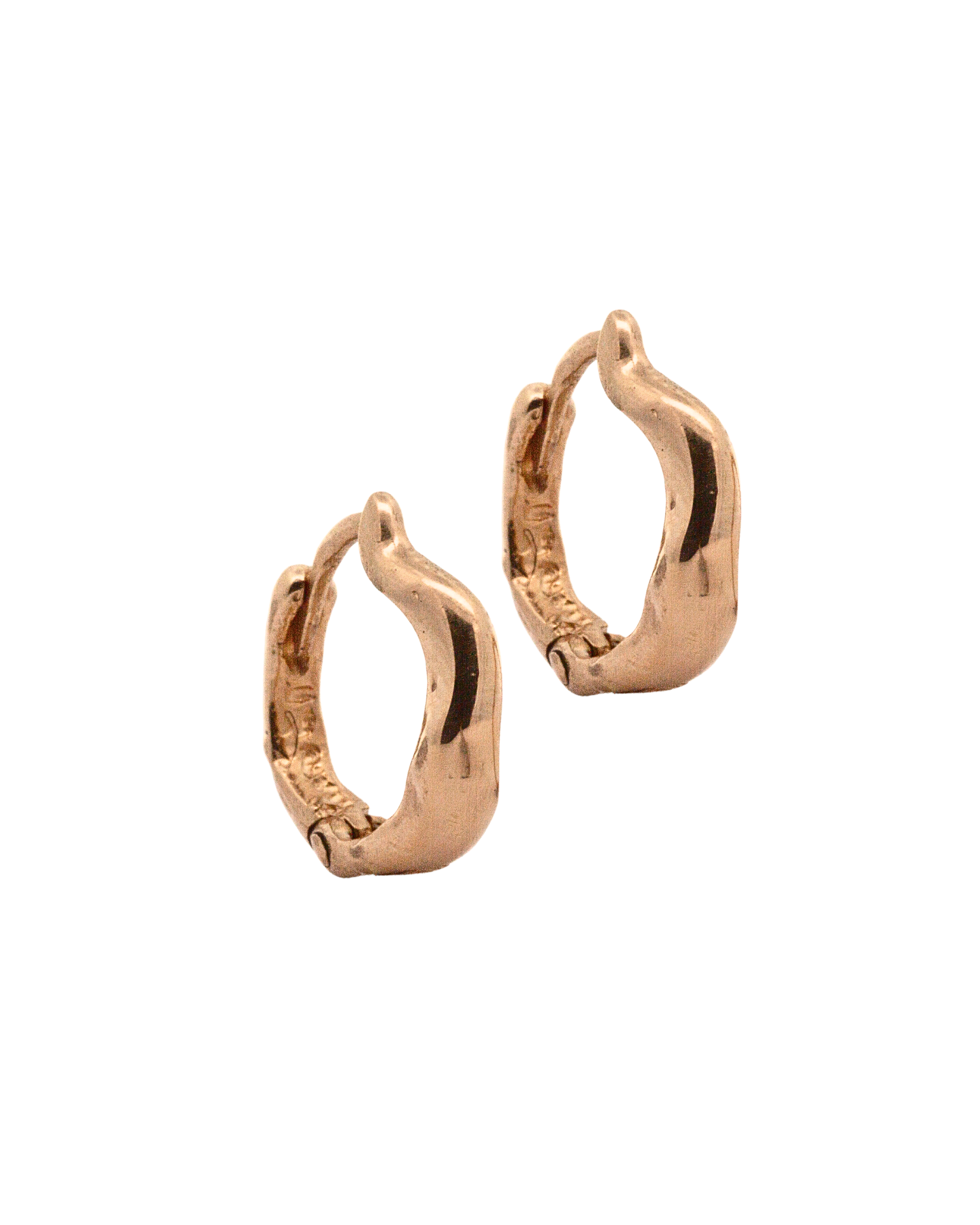 Close-up of Hand-Carved TILDA Huggie Hoops with Sculptural Design