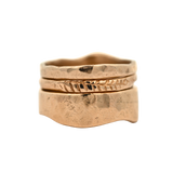 Close-up of SIGR WATER ring showcasing scuffed and hammered texture