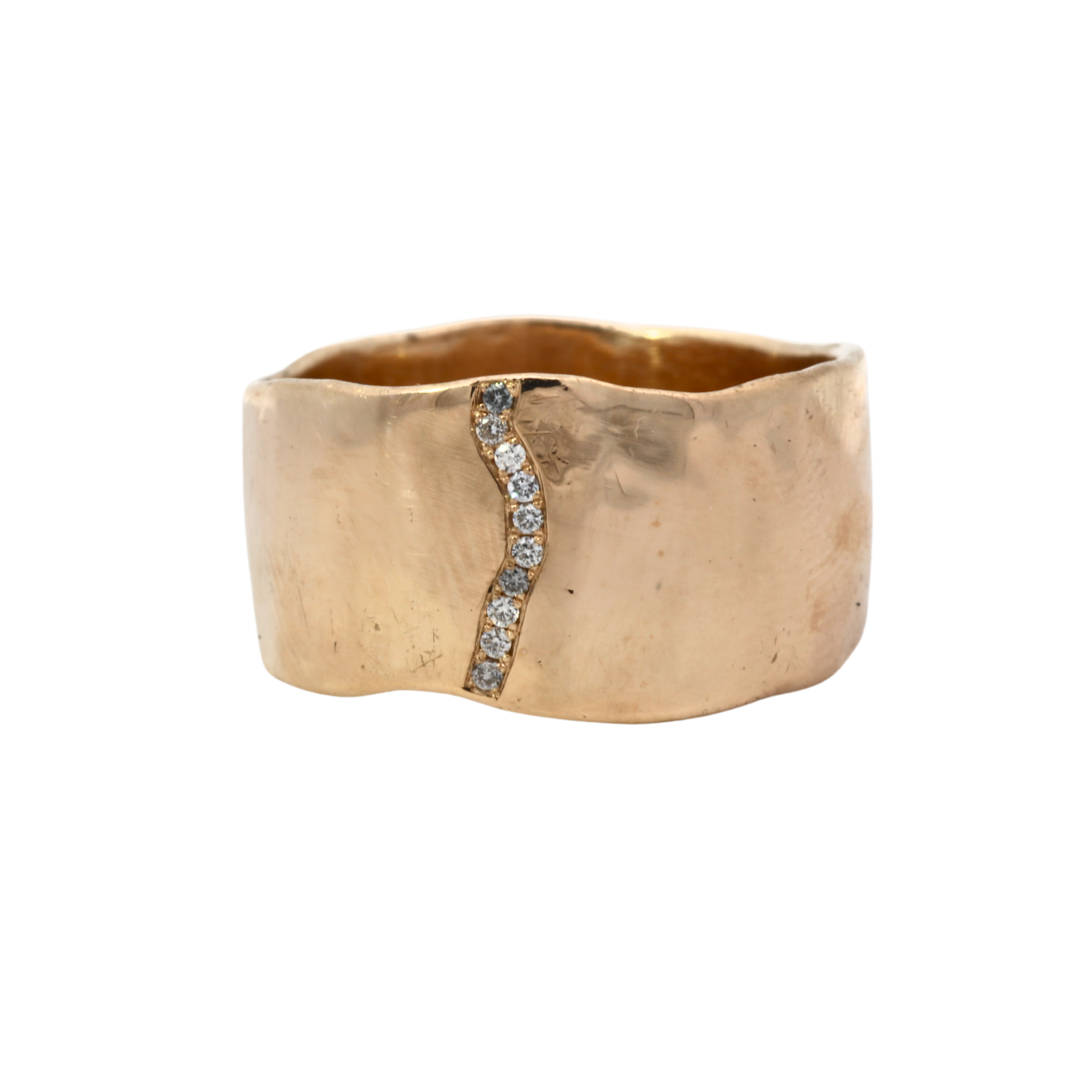 Close-up of SIGR WATER ring showcasing wavy edges and hammered texture