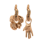 Close-up of hand-carved right-hand charm with champagne diamond