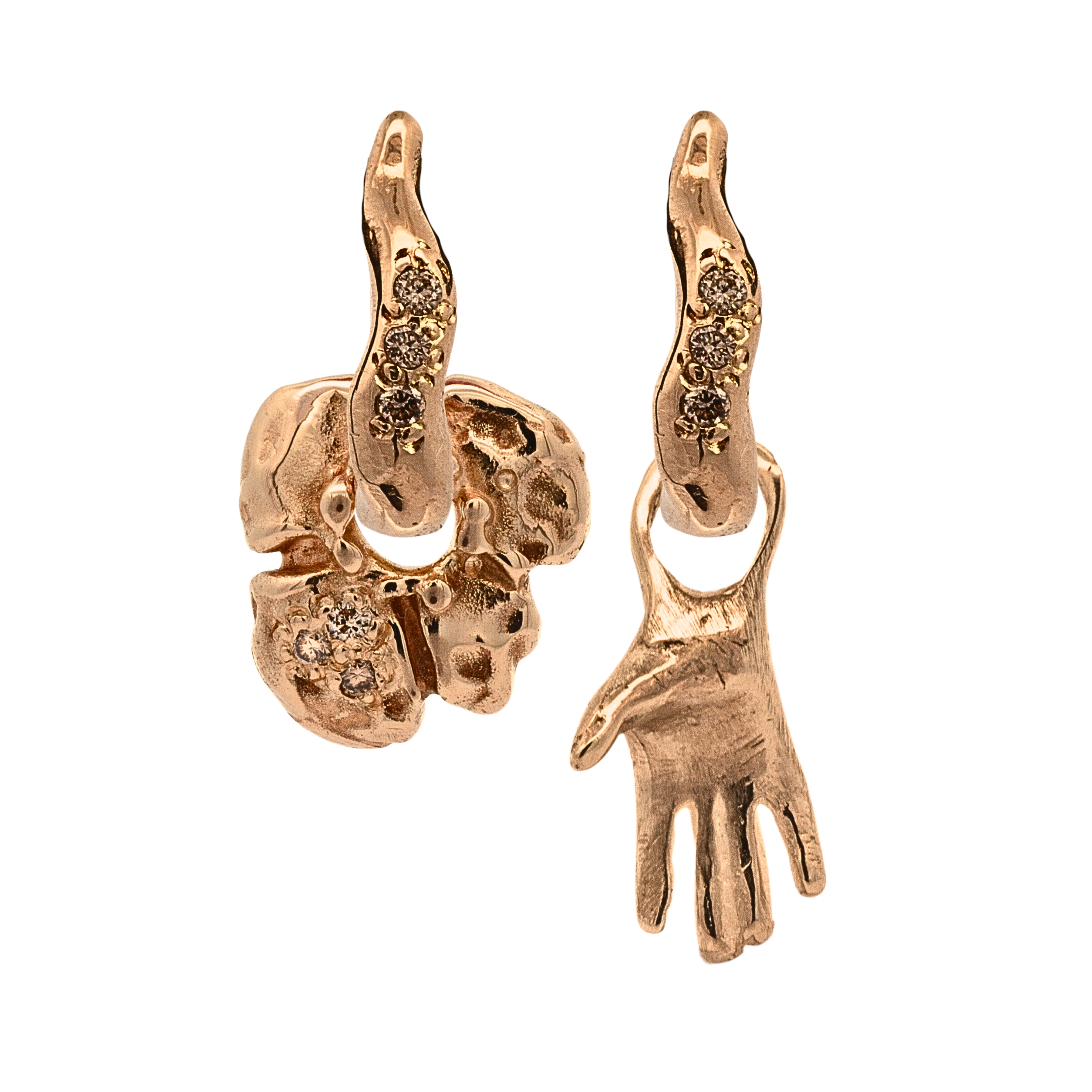 Close-up of hand-carved right-hand charm with champagne diamond