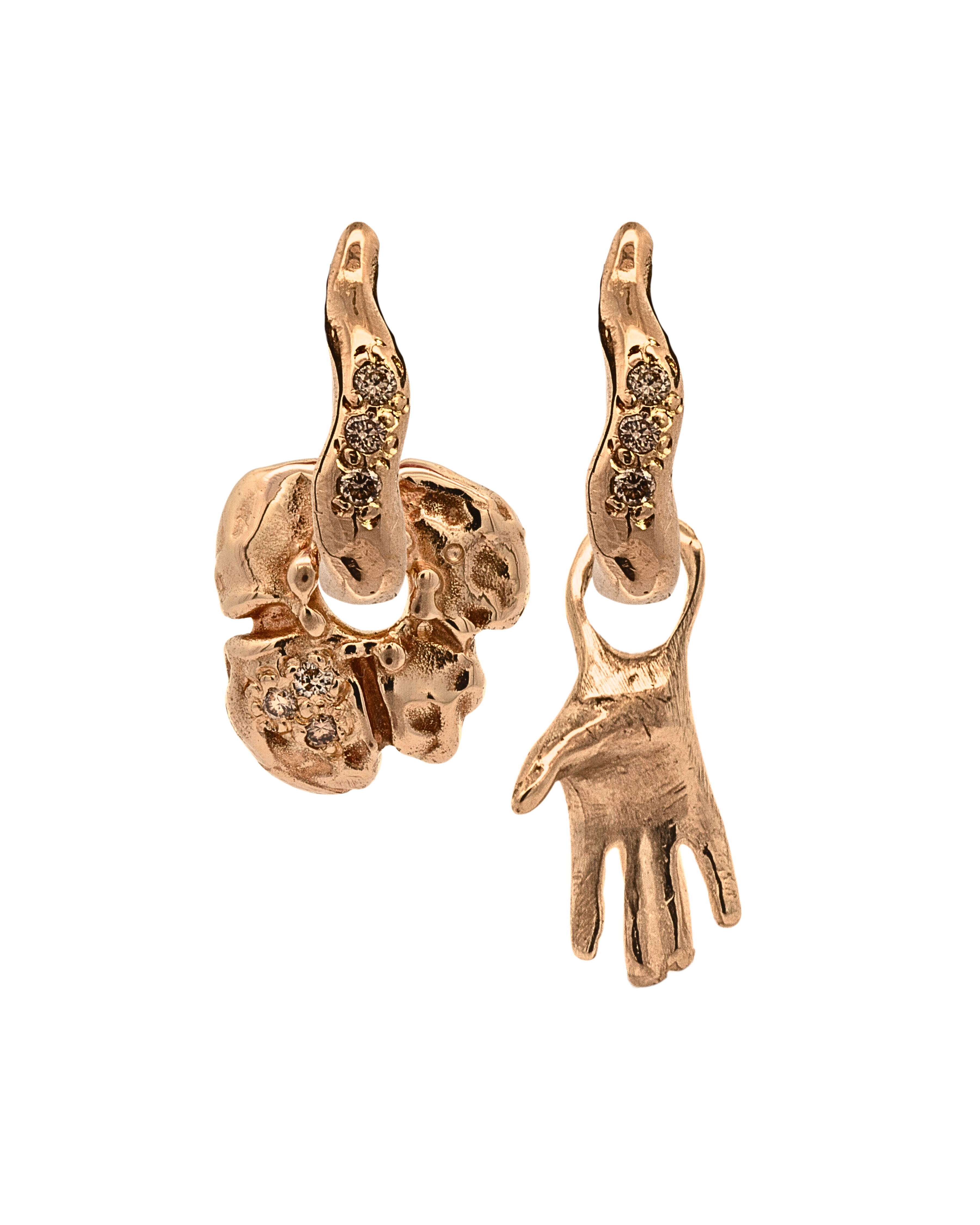 Close-up of hand-carved right-hand charm with champagne diamond