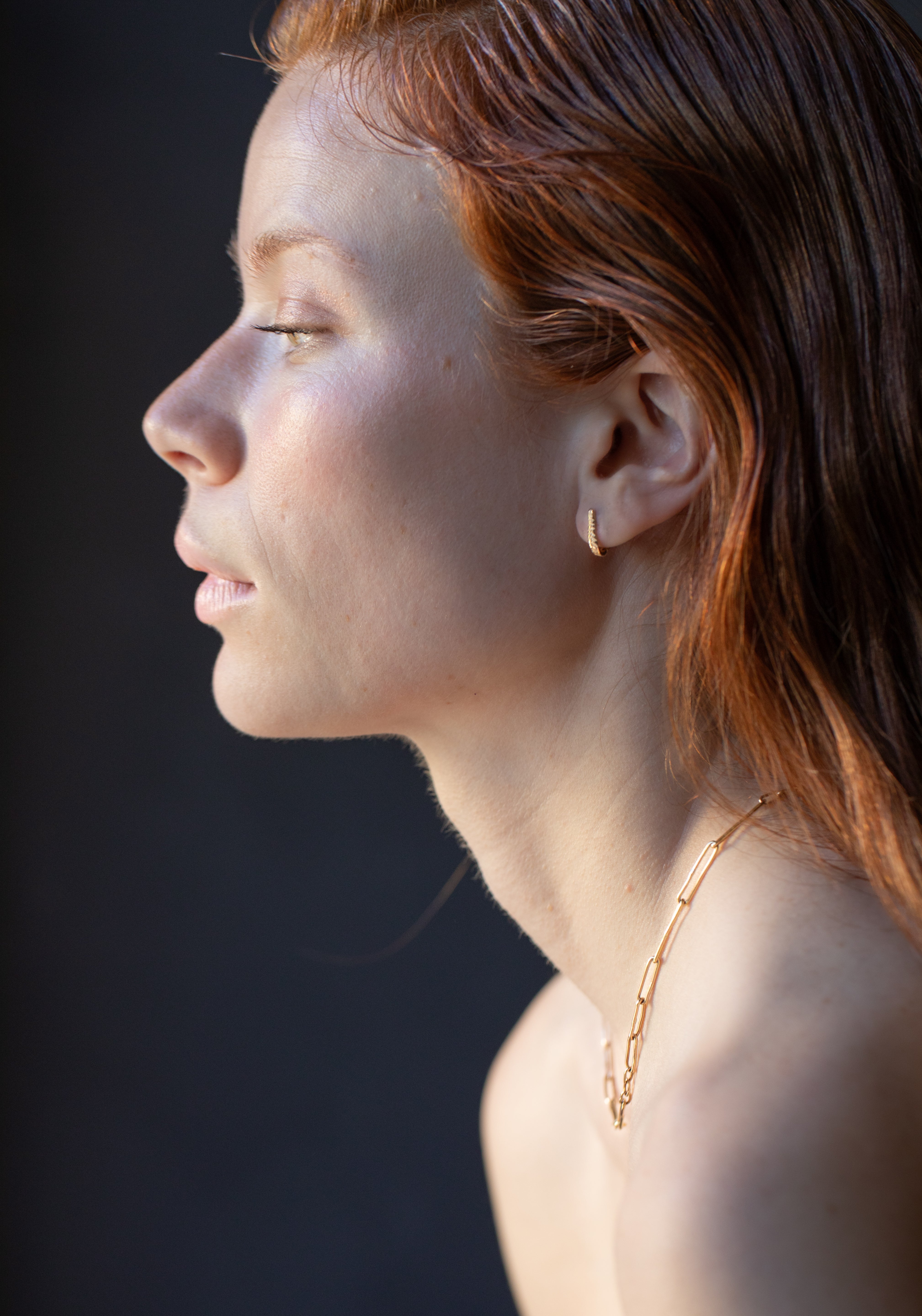 Model Wearing Crooked Fern Mini Hoop Earrings with Elegant Style

