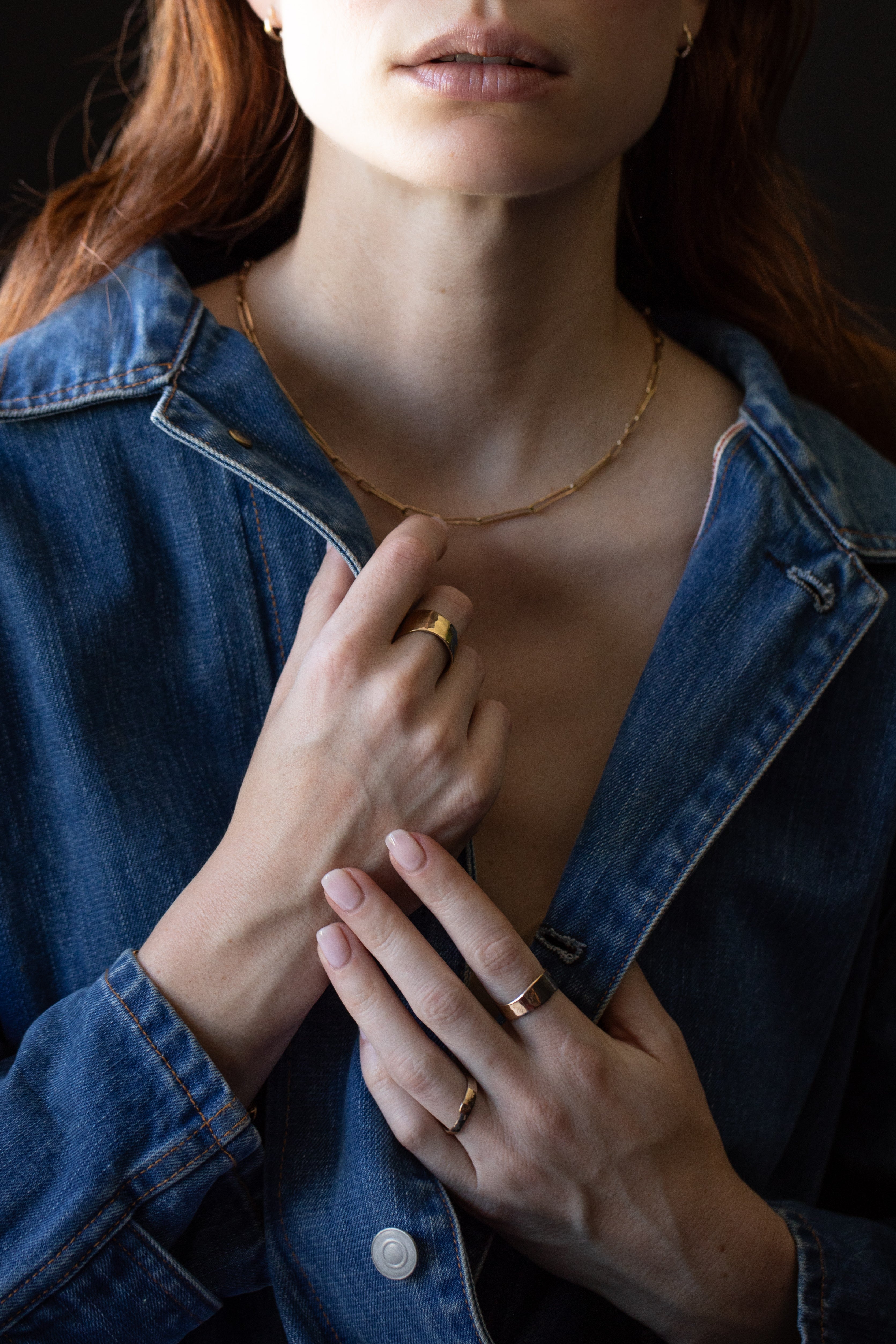 Model Wearing SIGR WATER Medium Band Ring with Sculptural Design

