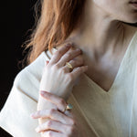 Model wearing TILDA Diamond Huggie Hoop Earrings in rose gold
