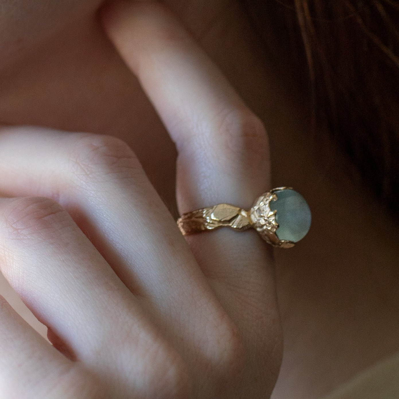 aqamarine statement ring with carved flowers cast in 14K gold