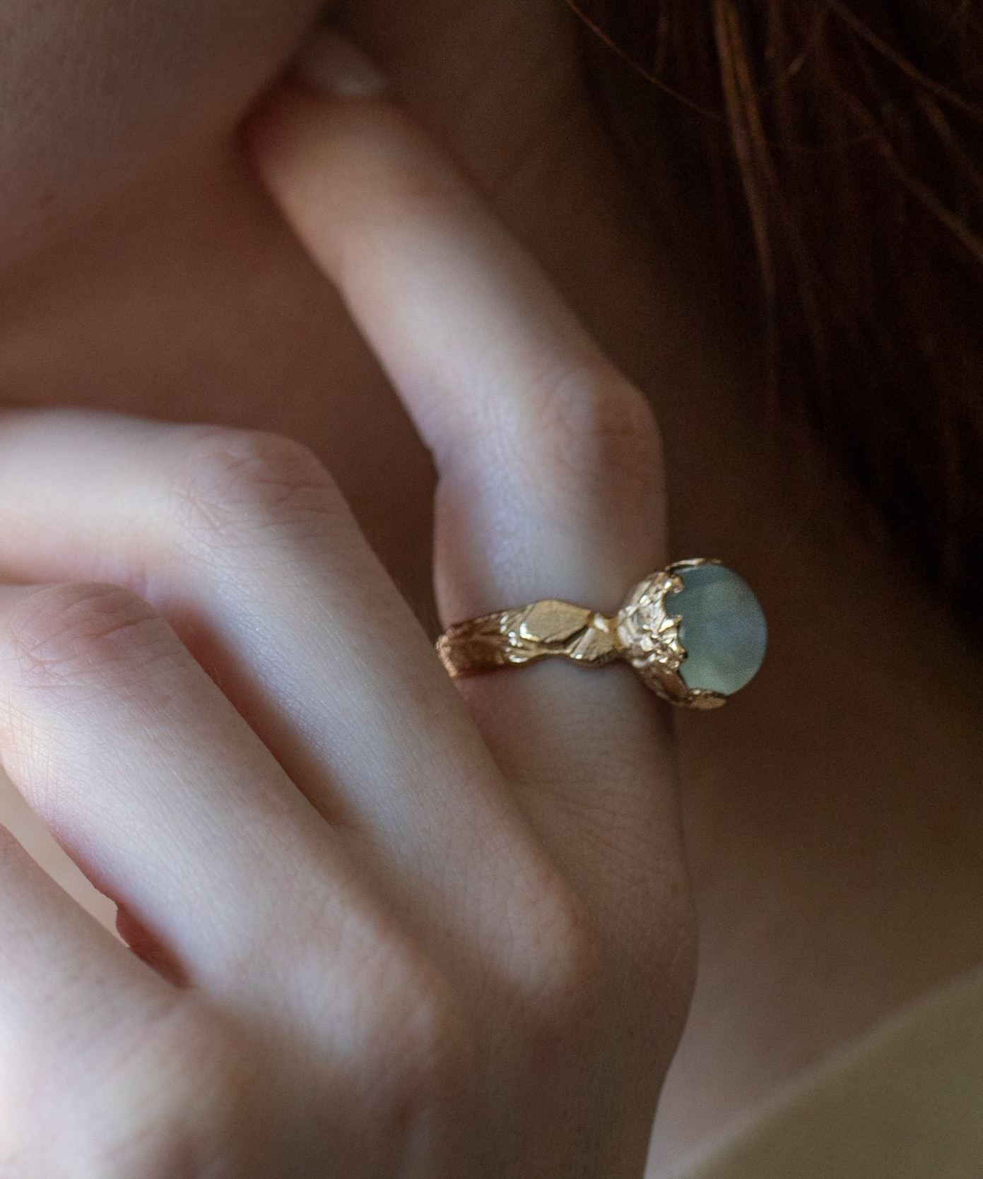 aqamarine statement ring with carved flowers cast in 14K gold