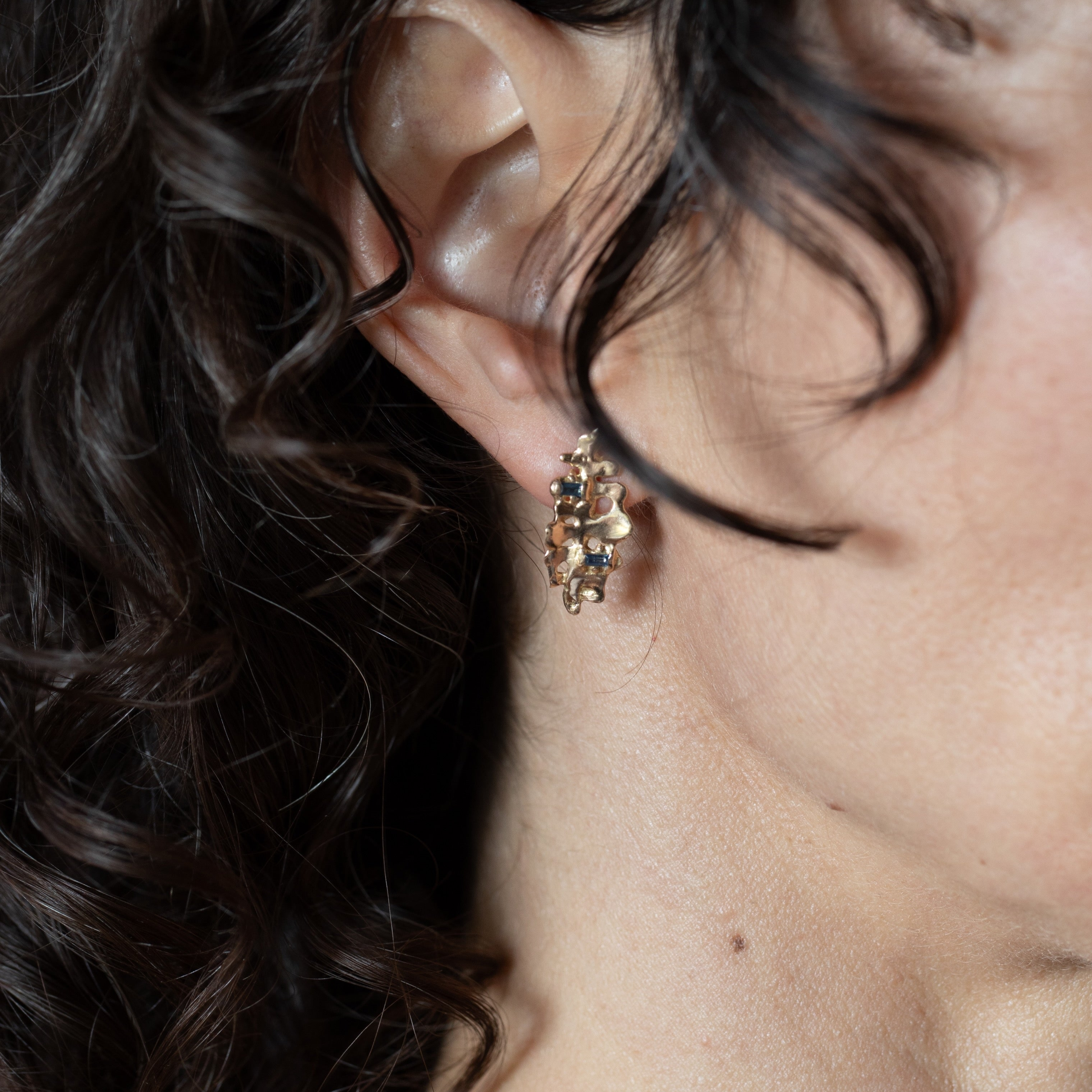 DORTE Earrings worn on ear, 14K Fairmined gold