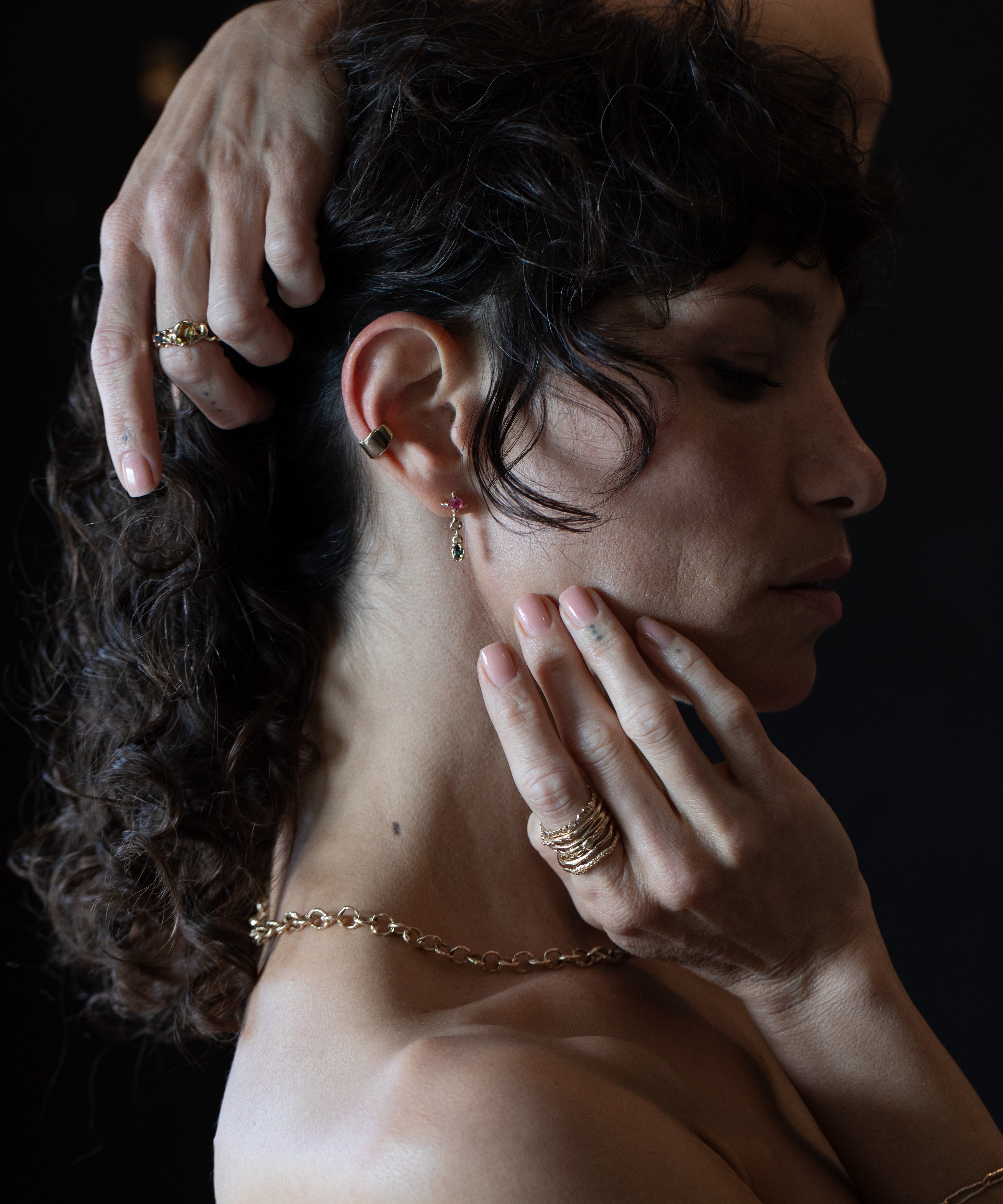 X TEAR Earrings texture close-up showing hand-carved detail, 14K Fairmined gold