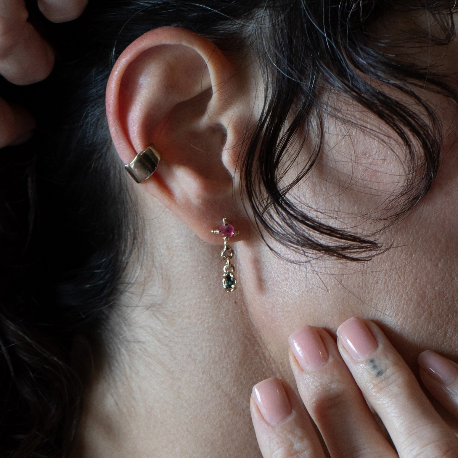 X TEAR Earrings worn on ear, 14K Fairmined gold